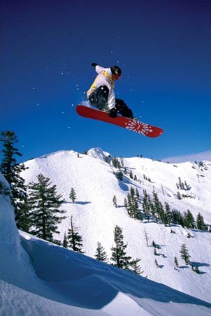 Snowboarder performing an Indy Grab - Snowboard Tricks